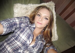 Broad shows off her shaved pussy and moreover boobs on camera that she holds in hand moreovers