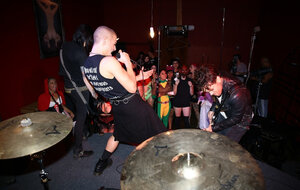 Babe is living it up at a rock concert and as singer comes closer she kisses him