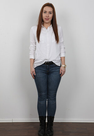 Kitten with green eyes and red hair wanted to corrupt photographer with her body