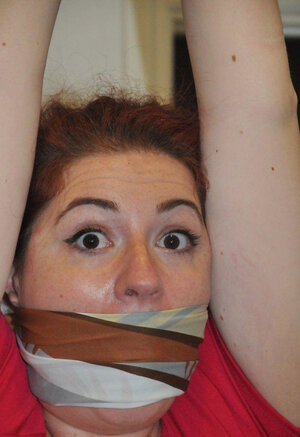 Dame in red dress is restrained by husband besides for being a bad wife and besides sex partner