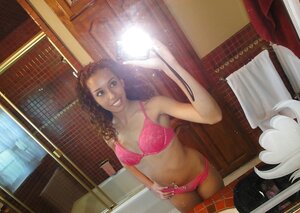 Curly Latina student broad takes some intimate pics in the bathroom