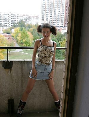 Russian schoolgirl with a couple of pigtails lets guy pound her on the public balcony