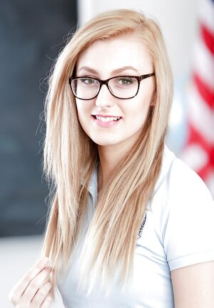 Small schoolgirl with smoking hot glasses shows off what is hidden under her uniform