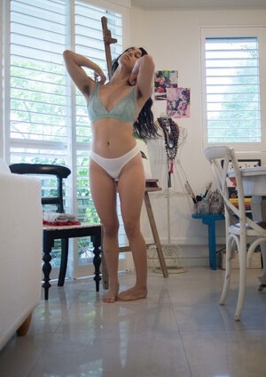 18-19 year old covers her big natural boobs with a lace bra then gets totally dressed