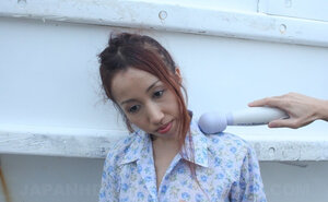 Stranger rubs Japanese girl's cum bucket with dong through the cloth near the port