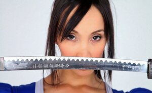 Cosplay screenshot session of Asian model with sizeable boobs, samurai's saber, and fan