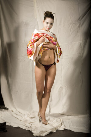 Slutty kitten in Japanese geisha outfit reveals her tempting young curves