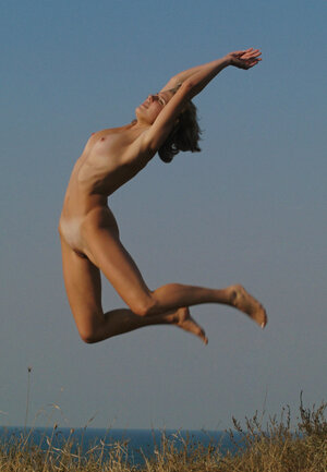 Good-looking teen with sexy tan lines relaxes completely undressed under the sun