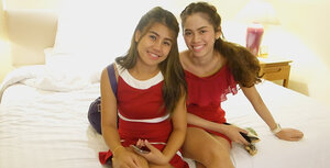 Thai floozy in a red dress never stops smiling even in the backseat of a taxi