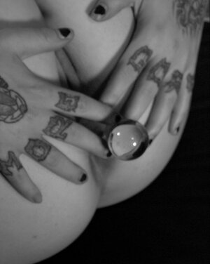 Babe with fuzzy hair reads a magazine and moreover masturbates in black and moreover white