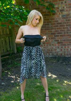 Blonde demonstrates her hefty natural bra buddies and round tooshie outdoors