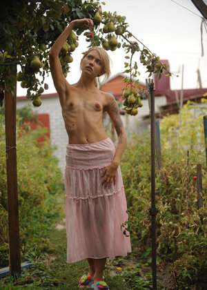 Slender blonde wakes up & goes in the garden to play with her pretty cat