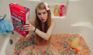Silly legal teen doll is being gorgeous and naughty while taking a bath