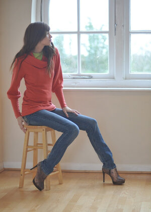 Simone takes off her blue jeans in a non-nude action