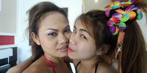 If you pay them well, a duo Thai teens will play with your flag pole