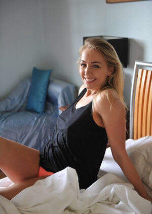 Hayley Coppin shows off her immaculate love bubbles and poses nude by the window