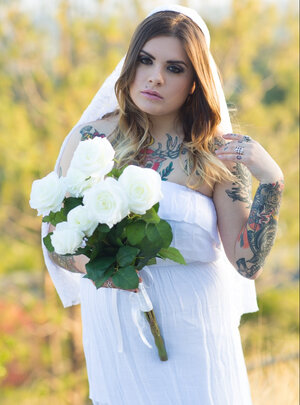 Bride with fantastic curves and plenty of ink slowly gets naked