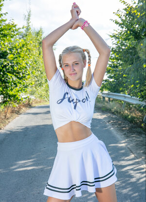 Attractive babe Nana strips to her socks and runners on a paved road